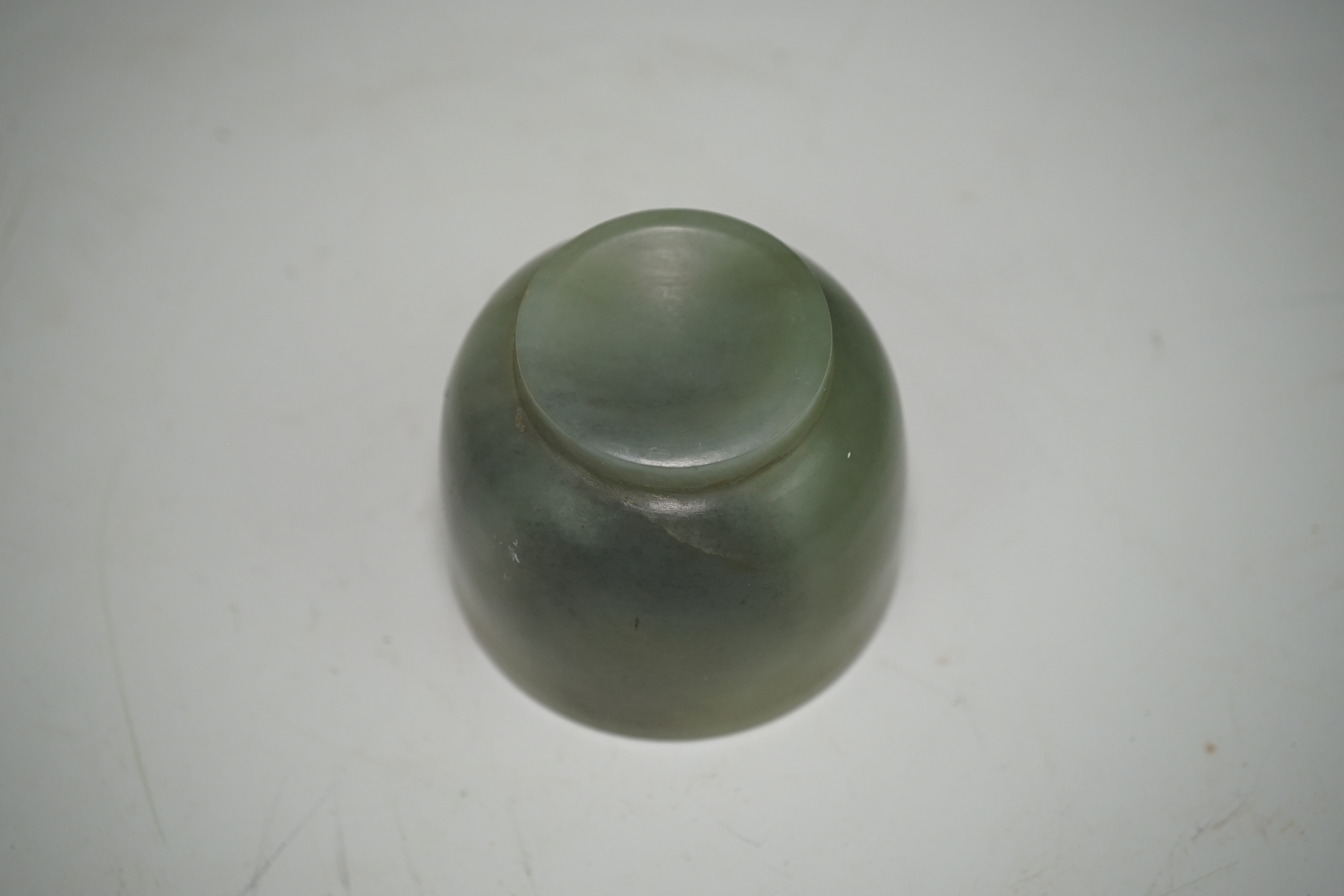 A Chinese pale celadon jade cup, 18th / 19th century